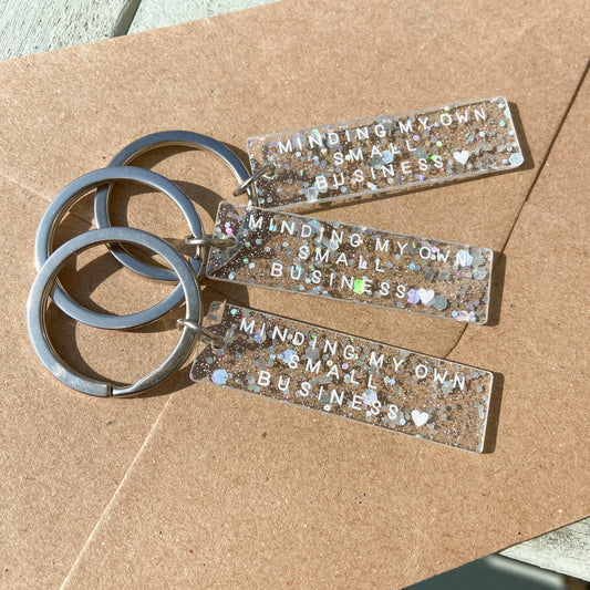 "Minding My Own Small Business" Holographic Glitter Keyring